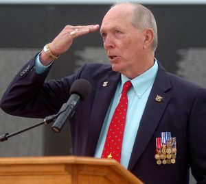Bill Schwertfeger, Lt. Col, USAF, Retired, POW Hanoi Hilton 71-72, salutes all service men who lost their lives defending the United States during his keynote address at the Vietnam Memorial Wall Name Placement Ceremony at Enid Woodring Regional Airport Friday, May 16, 2014. (Staff Photo by BONNIE VCULEK)